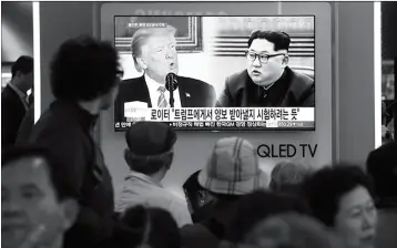  ?? ASSOCIATED PRESS ?? PEOPLE WATCH A TV SCREEN showing file footage of U.S. President Donald Trump and North Korean leader Kim Jong Un during a news program at the Seoul Railway Station in Seoul, South Korea, Wednesday.