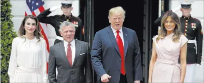  ?? Evan Vucci ?? The Associated Press President Donald Trump and first lady Melania Trump stand with King Abdullah II of Jordan and Queen Rania at the White House.