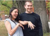  ??  ?? Sara Trigero shows the engagement ring given her by Dallin Knecht, right.