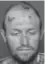  ??  ?? Thomas Busch, 37, allegedly led police on a chase downtown last week while driving a John Deere tractor. He also allegedly bit a police dog.