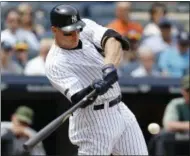  ?? KATHY WILLENS — THE ASSOCIATED PRESS ?? New York Yankees Aaron Judge hits a grand slam during the third inning of a baseball game against the Oakland Athletics in New York, Sunday.