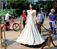  ?? Reuters ?? People look at a statue resembling Israeli Minister Miri Regev at the plaza of Israel’s national theatre, Habima, in Tel Aviv. —