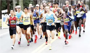  ??  ?? Participan­ts compete in the men’s elite during the 2019 Boston Marathon in this April 15 file photo. — USA TODAY Sports photo