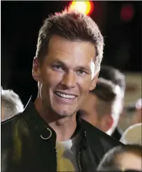  ?? CHRIS PIZZELLO — THE ASSOCIATED PRESS ?? NFL quarterbac­k Tom Brady, a cast member and producer of “80 for Brady,” looks down the carpet at the premiere of the film, Tuesday, at the Regency Village Theatre in Los Angeles.