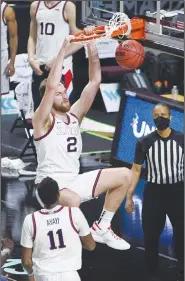  ?? Associated Press ?? Slammed: Gonzaga forward Drew Timme (2) dunks during the second half of an NCAA college basketball game for the West Coast Conference men's tournament championsh­ip last week in Las Vegas.