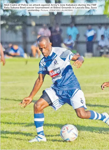  ?? Picture: JONACANI LALAKOBAU ?? Meli Codro of Police on attack against Army’s Jone Kabakoro during the FMF Ratu Sukuna Bowl soccer tournament at Bidesi Grounds in Laucala Bay, Suva
yesterday.