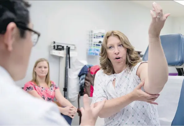  ?? PHOTOS: THE ASSOCIATED PRESS ?? Dr. David Song transferre­d lymph nodes from Susan Wolfe-Tank’s back and side to her arm to ease swelling called lymphedema, caused by her cancer treatment.