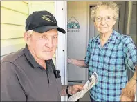  ?? SUBMITTED PHOTO ?? Burnt Point resident John Walsh calls on neighbour Annabelle Crane of Georgetown Royalty to hand out a flyer urging residents to attend a public meeting on amalgamati­on next Monday.