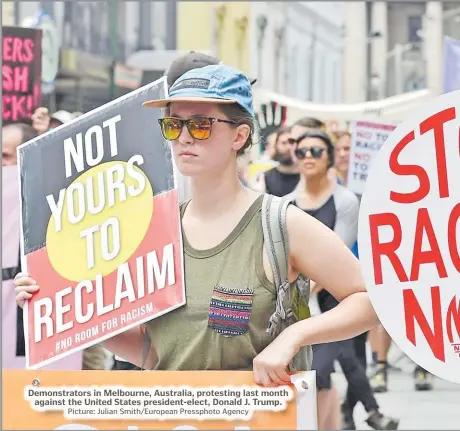  ?? Picture: Julian Smith/European Pressphoto Agency ?? Demonstrat­ors in Melbourne, Australia, protesting last month against the United States president-elect, Donald J. Trump.