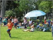  ??  ?? Hundreds attend the Great American Solar Eclipse viewing party at the future site of the Oneida Public Library on Monday.