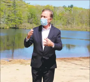  ?? Pat Eaton- Robb / Associated Press ?? Gov. Ned Lamont speaks to reporters at Gay City State Park in Hebron on May 21. The governor held his daily COVID- 19 briefing for the media at the park in advance of the Memorial Day weekend.