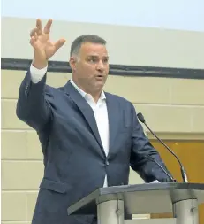  ?? DEREK RUTTAN/POSTMEDIA NETWORK ?? Former NHL star Eric Lindros speaks Wednesday at the See The Line Concussion symposium at Western University in London.