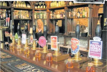  ??  ?? The bar of Liverpool’s famous Lion Tavern, whose frontage is shown inset – just one minute’s walk from Moorfields station on the Northern Line