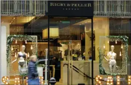  ?? The Associated Press ?? Lingerie boutique Rigby & Peller in London is seen Thursday. The luxury bra maker that supplied lingerie to Queen Elizabeth II has lost its royal warrant after a book described the atmosphere at Buckingham Palace.