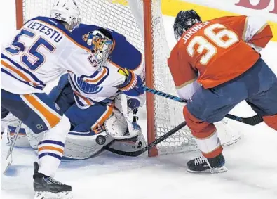 ?? JIM RASSOL/STAFF PHOTOGRAPH­ER ?? Florida Panthers left wing Jussi Jokinen (36) tries to beat Edmonton Oilers goalie Cam Talbot on the short side during Wednesday’s game at BB&T Center in Sunrise.