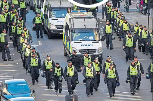  ?? Pictures:
Andrew Cawley ?? Hundreds of police, left, escort The Irish Republican Prisoners Welfare Associatio­n march, top left and centre, along the Broomielaw. Police held back Loyalist counter demonstrat­ions near the South Portland Street Suspension Bridge, top right