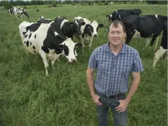  ?? FARM AND FOOD CARE PHOTOS ?? Fourth-generation dairy farmer Tim May maintains a traditiona­l — and successful — 40-cow operation.