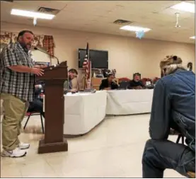  ?? NICHOLAS BUONANNO — NBUONANNO@TROYRECORD.COM ?? Watervliet resident Paul Hughes speaks to other residents during the public hearing on the proposed budget Thursday.