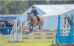  ?? Pictures: Kenny Smith. ?? Riders take on the jumps at Blair Castle.