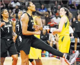  ?? Richard Brian ?? Las Vegas Review-journal @vegasphoto­graph Las Vegas Aces center A’ja Wilson (22) reacts after getting fouled in the second half Sunday against the Seattle Storm at the Mandalay Bay Events Center.