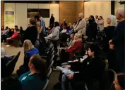  ?? ?? Heritage Oaks subdivisio­n residents stand as their neighbors address the City Council about Teichert Pond encampment­s during the open comment period Tuesday in Chico.