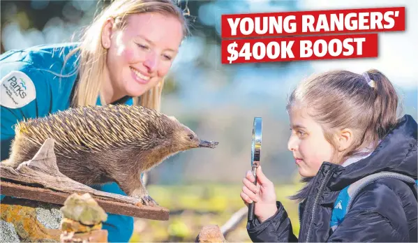  ?? Picture: MARK STEWART ?? STARTING YOUNG: A $400,000 funding boost will help conitinue the Junior Rangers program. Ranger Ness is pictured with Andriana, 7.