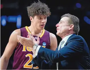  ?? JOHN MINCHILLO/ASSOCIATED PRESS ?? Iona head coach Rick Pitino, right, speaks with Michael Jefferson (23) during the second half of their NCAA Tournament game against Connecticu­t on Friday in Albany, N.Y.