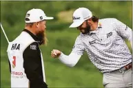  ?? Nick Wass / Associated Press ?? Max Homa celebrates with his caddie after winning the Wells Fargo Championsh­ip on Sunday at TPC Potomac at Avenel Farm golf club in Potomac, Md.