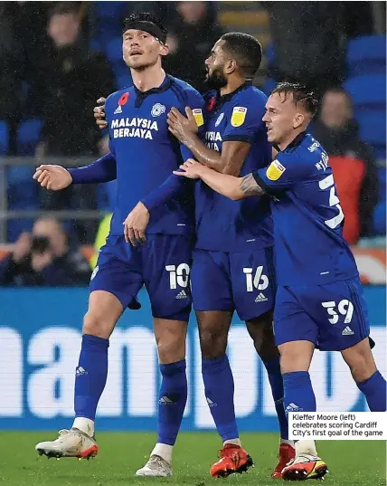  ?? ?? Kieffer Moore (left) celebrates scoring Cardiff City’s first goal of the game