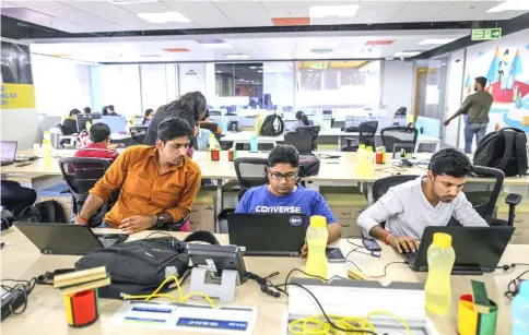  ??  ?? Employees work on laptops at the Flipkart Online Services headquarte­rs in Bengaluru, India, on Feb 3, 2017. — WP-Bloomberg photo