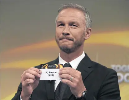  ??  ?? Former Sweden defender Patrik Andersson shows the name of Rostov during the draw for the Europa League round of 16.