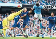  ?? Photo: GETTY IMAGES ?? Asmir Begovic, of Chelsea, accidental­ly punches team-mate Gary Cahill in the face as he attempts to clear during the Premier League match against Manchester City at Etihad Stadium.