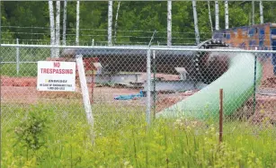  ?? Associated Press photo ?? In this June 29, 2018 file photo, a No Trespassin­g sign is visible at a Enbridge Energy pipeline drilling pad along a rail line that traces the Minnesota-Wisconsin border south of Jay Cooke State Park in Minnesota. Gov. Tim Walz says his administra­tion will continue to appeal a regulatory commission’s approval of Enbridge Energy’s plan to replace its aging Line 3 crude oil pipeline. The commission approved the project last summer, but former Gov. Mark Dayton’s Department of Commerce appealed that decision, as did several environmen­tal and tribal groups. An appeals court decision last week sent the challenges back to the commission for further proceeding­s.