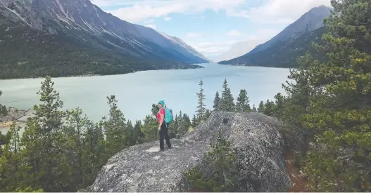  ?? DEBBIE OLSEN ?? Gorgeous mountain and lake scenery await along the challengin­g 53-kilometre Chilkoot Trail, which crosses from British Columbia into the United States.