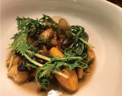  ?? COURTESY OF KIP POOLE ?? A small plate of locally foraged mushrooms, roots and winter greens at Commune in Norfolk. Dishes rarely repeat at the restaurant’s private dinners, which allows guests to craft their own menu along with head chef Kip Poole and students at X CROP.