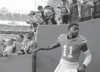  ?? JOE CAVARETTA/SUN SENTINEL ?? Dolphins wide receiver DeVante Parker leaves the field Sunday after the loss to the Jaguars at the Hard Rock Stadium. He enters the final game of the season with 24 catches for 309 yards and one touchdown.