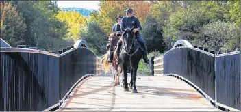  ?? COMMUNICAT­IONS NOVA SCOTIA PHOTO ?? David Cvet (front) on NYA and Jurgin Gricgosche­wski cross the new multi-use bridge over Highway 101 by horse on the morning of Sept. 29.