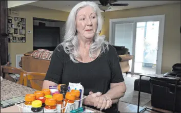  ?? Phelan M. Ebenhack The Associated Press ?? Retiree Donna Weiner with her daily prescripti­on drugs Tuesday at her home in Longwood, Fla. She pays over $6,000 a year through a Medicare prescripti­on plan.