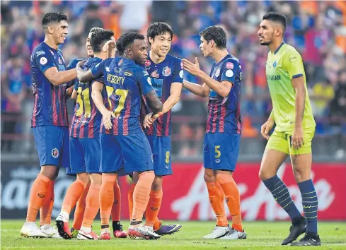  ??  ?? Port’s Ko Seul-Ki, No.8, celebrates with teammates after scoring against Samut Prakan City.