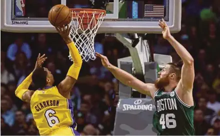  ?? EPA PIC ?? Boston Celtics centre Aron Baynes (right) blocks the shot of LA Lakers guard Jordan Clarkson during their NBA game on Wednesday.