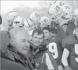  ?? Ann Heisenfelt Associated Press ?? JOHN GAGLIARDI is cheered by his son Jim, St. John’s offensive coordinato­r, and the Johnnies after he passed Eddie Robinson with his 409th victory in 2003.