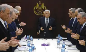  ?? (Mohamad Torokman/Reuters) ?? PALESTINIA­N AUTHORITY President Mahmoud Abbas prays at the start of a leadership meeting yesterday in Ramallah.