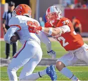  ?? JIM THOMPSON /JOURNAL ?? UNM’s Johnny Hernandez, right, tries to tackle Sam Houston’s Chandler Harvin in the opener. Hernandez, a former walk-on, led the Lobos with 11 tackles.