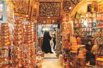  ?? AFP ?? Left: Women shop at Tehran’s ancient Grand Bazaar.