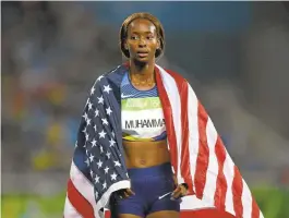  ?? SHAUN BOTTERILL/GETTY IMAGES ?? Dalilah Muhammad of the United States celebrates winning gold Thursday in the Women’s 400 Hurdles at the Rio 2016 Olympic Games.