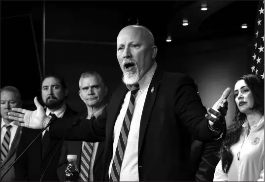  ?? J. SCOTT APPLEWHITE / ASSOCIATED PRESS ?? Rep. Chip Roy, R-texas, is joined by fellow members of the conservati­ve House Freedom Caucus in denouncing the spending package being readied for a vote March 22 at the Capitol in Washington.