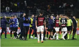  ?? ?? Photograph: Marco Luzzani/Getty Images Olivier Giroud trudges off the field after Milan’s 1-0 defeat to Inter on Sunday.