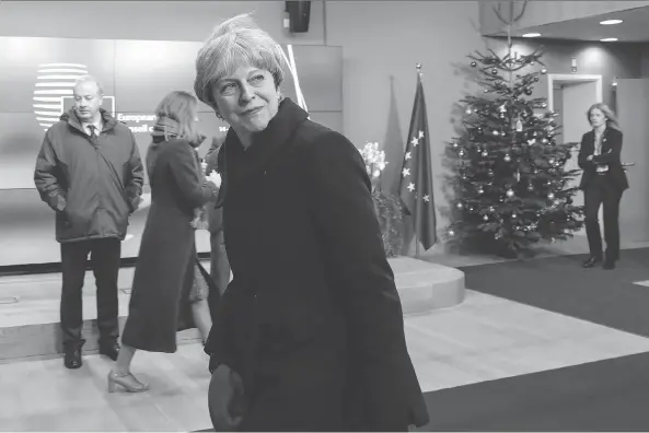  ?? DARIO PIGNATELLI/BLOOMBERG ?? British Prime Minister Theresa May leaves after attending a European Union leaders summit in Brussels on Friday. after the first phase of Brexit talks, EU leaders said “sufficient progress” had been made to start discussing a trade deal and future...