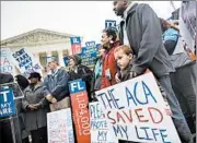  ?? JIM LO SCALZO/EPA ?? Supporters of the health care law rally last month by the Supreme Court, where the act’s subsidies are under fire.