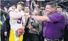  ?? JOHN BAZEMORE/ASSOCIATED PRESS ?? LSU quarterbac­k Joe Burrow, shown celebratin­g with head coach Ed Orgeron, took his graduate courses online, earning a master’s degree in liberal arts.